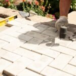 What is the average patio laying cost per m2 in the UK?