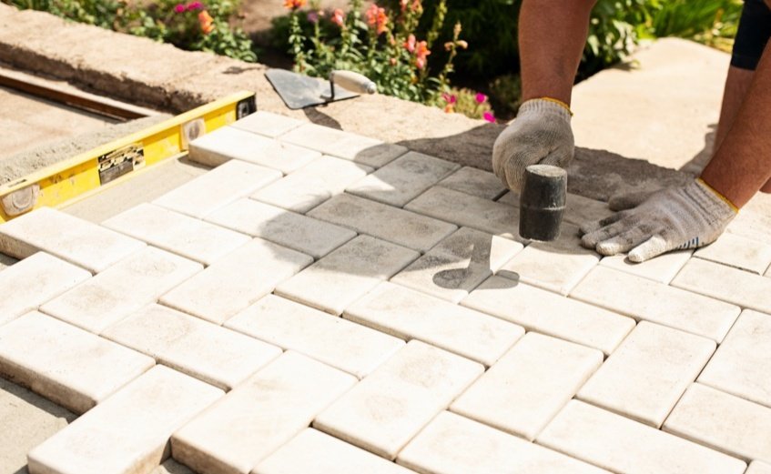 What is the average patio laying cost per m2 in the UK?